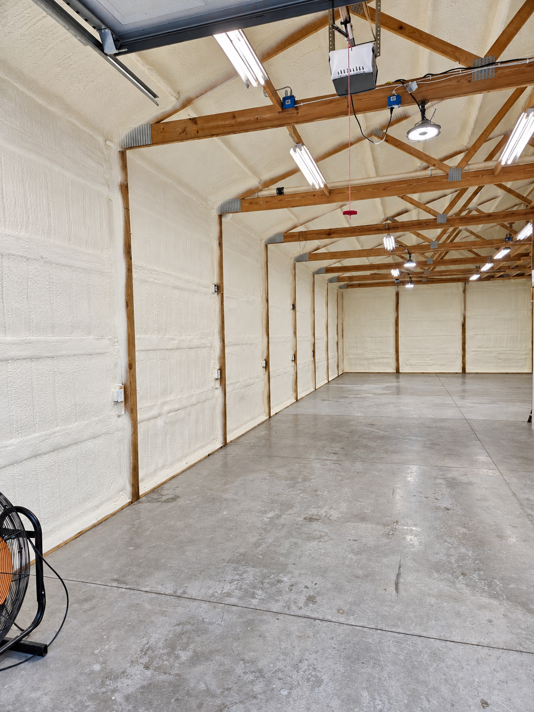 Completed insulated workshop interior with exposed wood framing